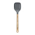 Gray spatula with wooden handle on a light gray background